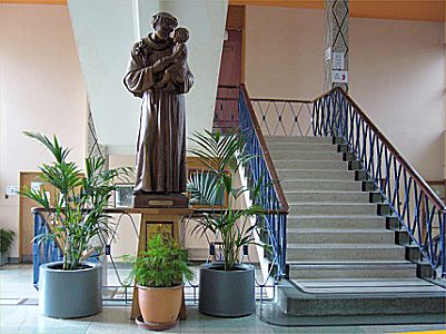 The collage staircase as it leads up from the foyer