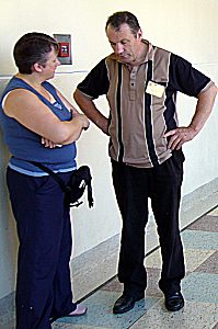 Discussion in corridor, Christine Grey and David Lee