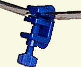 plastic clip with pipe in jaws