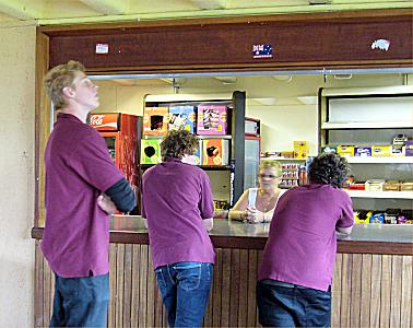 Staff at serving hatch in the basement coffee area