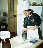 Hayley McCarron Grating chocolate for mixing with butter and honey